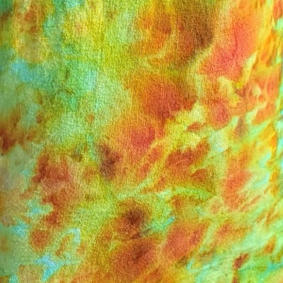 Scrunched, dye over ice on a 100% cotton shirt.