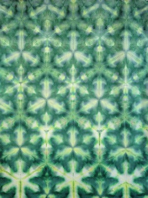 Shibori fold on quilter's cotton, dye under ice. Photo credit: Margo Farnsworth.